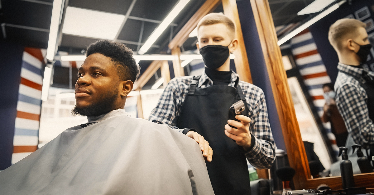 A bustling barbershop with animated conversations
